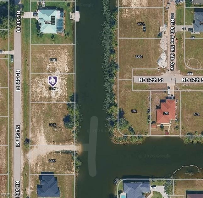 Located in a rapidly growing neighborhood of Cape Coral, this residentially zoned vacant lot offers the perfect blend of tranquility and convenience. Surrounded by newer construction and nestled on a fresh water canal, this eastern exposure property is just under a quarter acre and ready for your vision—whether you're a homeowner planning your dream build or a developer seeking a smart investment. This lot is tagged as Flood Zone X, NO flood insurance required and offers city water & sewer with 9 years of assessments around $3,734 per year to be assumed by new owner. Essential utilities including electric, phone, cable, and trash removal are available in the area, making development seamless. Attention Boat enthusiasts - Trailered boats can be taken to Cape Coral's boat ramp that is 10 to 15 minutes away. Enjoy easy access to Pine Island Rd, placing you just minutes US-41 & I-75 and within quick access to Port Charlotte, Punta Gorda and all of Cape Coral. This high-demand location offers proximity to shopping, dining, and medical facilities while maintaining a peaceful residential feel. Lots at this price and location don’t last long—secure your slice of Southwest Florida today!