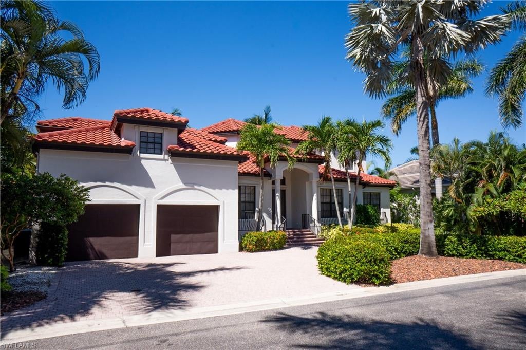 Welcome to Catalpa Cove, a prestigious gated boating community with estate homes and access to world-class boating from your own dock.  Enjoy direct Gulf access with no bridges to slow you down; open water is just minutes away.  Waterfront homes like this round out a life in many ways.  You’ll experience extreme comfort in this spacious updated home that blends into nature effortlessly.  Relax in your private pool or take the boat out to enjoy Southwest Florida’s award-winning beaches and fishing.  You can do it all from here, stress-free.  This home and neighborhood will impress with lush landscaping and friendly neighbors.  The grand entrance inspires, the abundant light lifts the spirits, and the spaciousness provides endless room to unwind or the perfect backdrop for entertaining.  The living room and kitchen provide a view of the waterfront and pool deck through large windows and sliding doors which also flood the home with natural light. Step through the sliding doors to the pool deck or take a few more steps down to the boat dock to enjoy the peaceful and private view of nature. The primary bedroom suite with fireplace and private balcony is found upstairs.  It provides maximum privacy.  For growing families there is a room that can be used as a nursery or office off the primary suite’s bathroom.  The primary bathroom has a soaking tub, a large walk-in shower, dual sinks along with a makeup station, and entrance into your walk-in closets.  Down the stairs and on the way to the office or guest suite stop at the covered outdoor seating area with built-in kitchen.  You’ll also find the gym and pool bath here.  The office or guest suite sits above the large garage and provides quiet and separation from the main living quarters.  Additional details of the home include a newer tile roof 2022, Calacatta marble countertops, custom kitchen cabinets, 20,000-lb boat lift, 2021 dock, wood-inlaid ceilings, infinity-edge pool has been resurfaced, a spa, and more.  This home has been extensively and tastefully updated to exceed today’s standards.  Seller will consider owner financing.