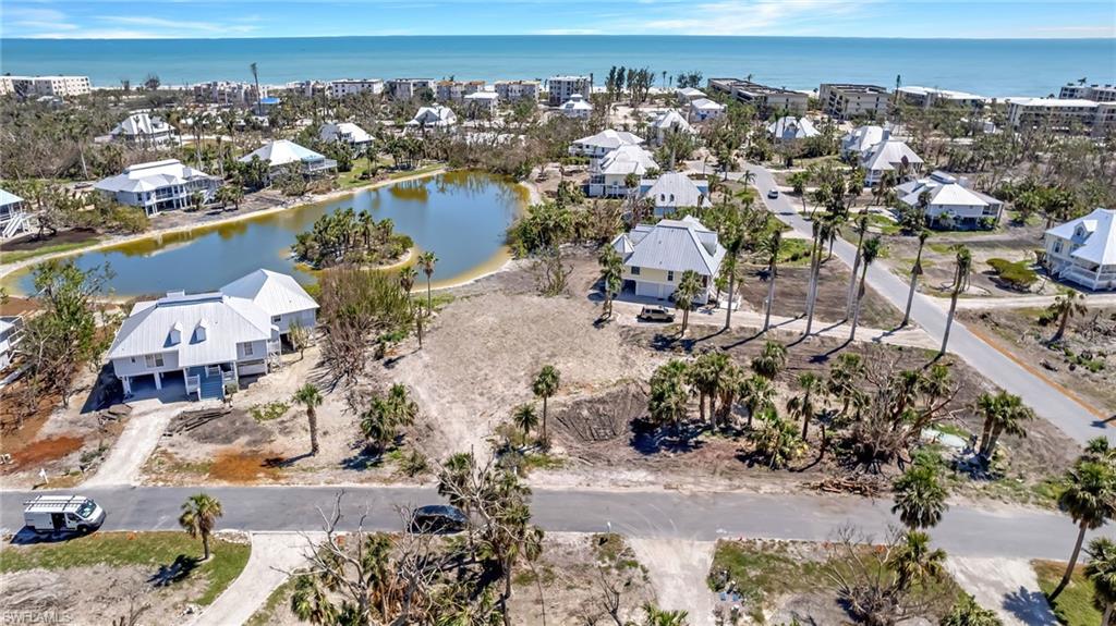 This is one of those extremely rare once-in-a-generation opportunities resulting from the adversity of Hurricane Ian. The former home (built in 1988) has been demolished leaving an unusually rare buildable lot in Sanibel's extremely popular near-beach community of Seagull Estates. This large lot is almost 1/2 an acre and is positioned to offer amazing lake views and a south-facing orientation for a new home to enjoy. No vacant lot has been traded in the history of the San/Cap MLS and this is currently the only vacant lot available or has been available in decades in this community. This Old Florida-inspired community has long been admired by buyers and locals alike and now someone has the opportunity to construct a new home, up to the newest standards in construction and luxury, all within the rhythm and harmony of the community's cohesive look. This property is literally just steps to the beach access, community pool, clubhouse, and Sanibel's miles of wonderful bike and walking paths. Ideally located off of West Gulf Drive, this opportunity to build new within the community of Seagull Estates is a truly unique, rare and once-in-a-generation.