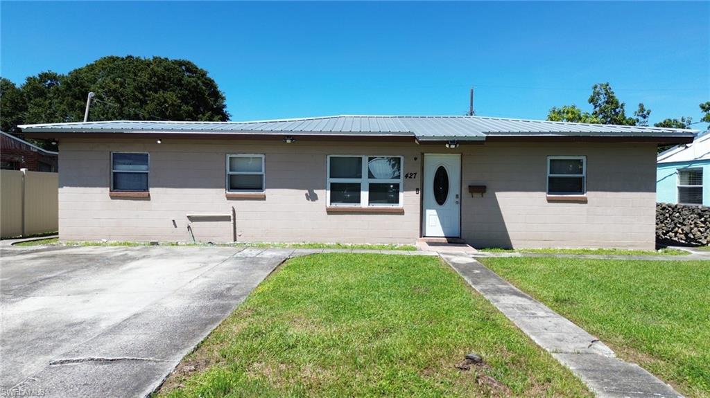 This charming 3-bedroom, 1-bath single-family home in Clewiston offers 1,146 square feet of comfortable living space and was built in 1960. The concrete-block exterior is topped by a durable 2020 metal roof, while central air conditioning keeps the interior cool year-round. The bathroom features a convenient shower only, and the home is served by city water and electric utilities. Tile throughout the house. There is an additional room that could be used for storage or as a den. A large, paved driveway provides parking for vehicles, and a useful shed sits in the backyard. Property's back yard is fenced in with a vinyl solid privacy fence added for your comfort. Conveniently located near shopping centers, medical centers and schools this is a great starter home. Call for your private showing today!