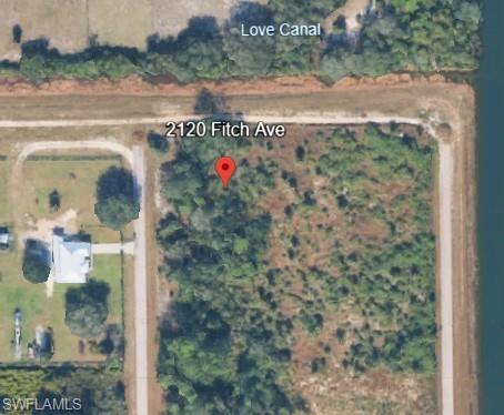 Highly desirable 1/2 acres located in fast growing area close to anything you need, with quick access to Fort Myers, SWFL reginal airport, boating, fishing and lots of Sunshine perfect Lot to build your next home.