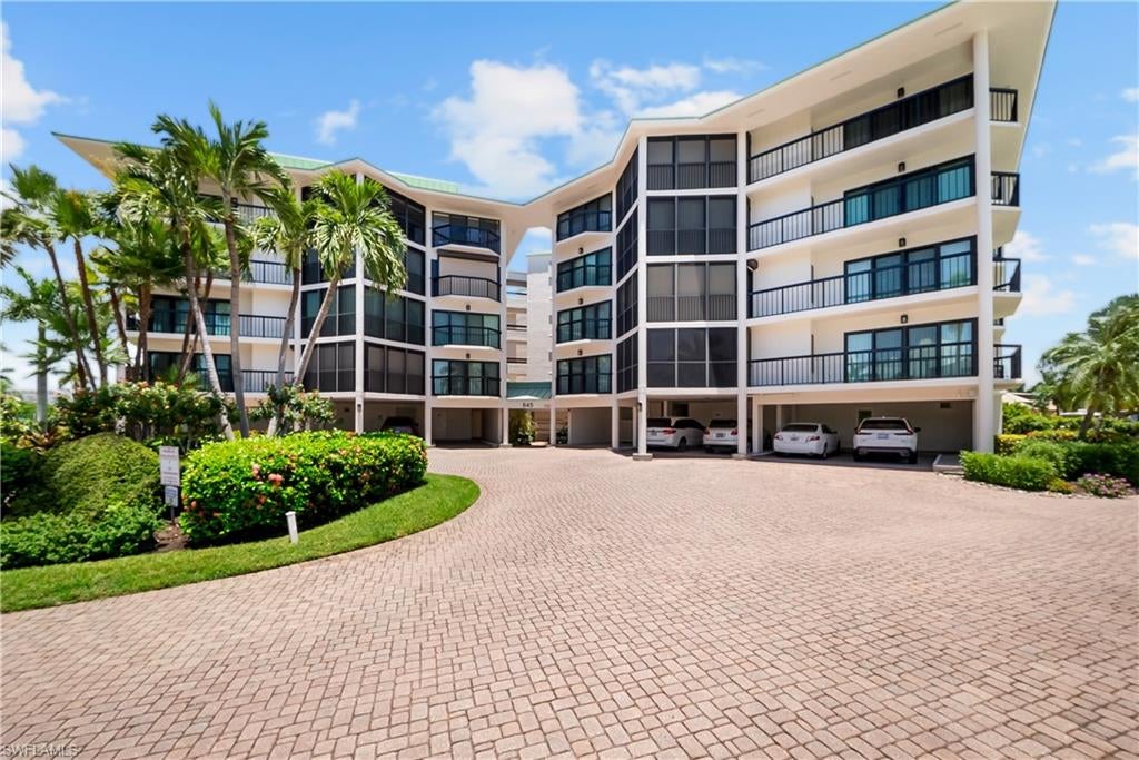 TURNKEY FURNISHED, BOAT DOCK AND WATER VIEWS AT TROPICAL ISLES! Discover the ultimate waterfront condo for sale on Marco Island. A true boater’s paradise located in the highly desirable South Island neighborhood. This COMPLETELY UPDATED luxurious fifth-floor Gulf-access condominium offers quick direct boating access to the Gulf of Mexico and includes your own private boat dock, making it ideal for boating enthusiasts and luxury buyers seeking premium coastal living. Featuring 2 bedrooms PLUS DEN, 2.5 baths, and 1,800 sq. ft. of beautifully designed living space, this Marco Island waterfront condo blends comfort, elegance, and breathtaking water views from every room. Large impact-resistant windows and sliders flood the home with natural light and creates the perfect indoor-outdoor living experience overlooking the tranquil canal. The gourmet kitchen offers shaker-style cabinetry, a breakfast bar, and new appliances, including a French door refrigerator. The spacious owner’s suite opens to a wrap-around balcony and features panoramic water views, along with a luxurious en-suite bath complete with a vanity and glass-enclosed walk-in shower. The private guest bedroom also includes its own balcony and adjacent full bath. Additional highlights include a laundry room with cabinetry and front load washer/dryer, luxury vinyl flooring, NEW CARPETING, NEW INTERIOR SLIDER and a covered parking space. Tropical Isles is one of Marco Island’s most desirable low-density communities, offering top-tier amenities such as a heated pool, fitness center, community room, hobby room, rentable kayak racks, a library, and ample covered parking with bike racks. Situated on a quiet cul-de-sac, this condo is less than one mile from South Beach access and close to world-class dining, shopping, entertainment, mini golf, a movie theater, and the island’s executive airport. If you’re searching for a Marco Island condo with direct Gulf access, private dock, and resort-style amenities, this exceptional waterfront residence delivers the best of the Florida lifestyle, luxury, convenience, and unmatched coastal living.
