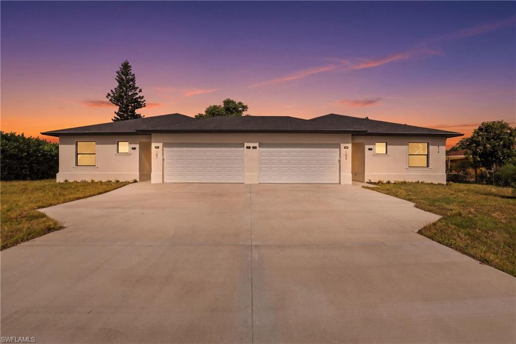 One or more photo(s) has been virtually staged, AI generated or rendered.  BRAND NEW CONSTRUCTION DUPLEX – PRIME LOCATION! The only brand-new, true duplex with DOUBLE CAR GARAGE on each side currently available in Golden Gate City! This property features open-concept living, sleek tile floors, and stainless steel appliances. Each unit offers an ideal 3-bedroom, 2-bathroom layout with 1,832 SQ FT per side total area, complete with its own double car garage, driveway, private outdoor space, individual washer/dryer hookups, and tankless water heater. Built with IMPACT- RESISTANT WINDOWS AND DOORS providing peace of mind, energy efficiency, and long-term durability. An exceptional investment opportunity with STRONG PROJECTED RENTAL INCOME of approximately $3,500 per side, per month. Enjoy a prime location in the heart of Golden Gate City, minutes from shopping, dining, top-rated schools, and Naples’ beautiful beaches. Situated on a spacious quarter-acre lot, offering both privacy and curb appeal. Primary suites feature ensuite baths with walk-in showers and WALK-IN CLOSETS. Don’t miss the perfect opportunity to live in one unit and rent the other — or lease both for exceptional investment returns.