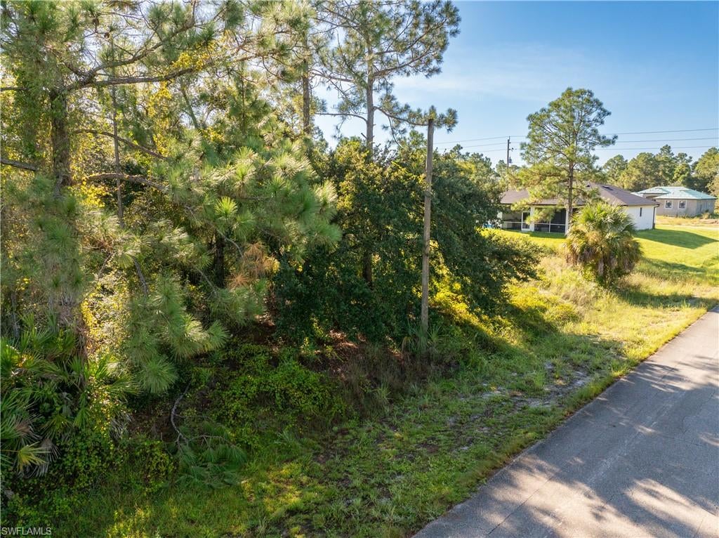 Great Investment! .5 Acre Almost Cleared Lot on Paved Road in Lehigh Acres. This stunning .5-acre lot is in the very fast-growing community of Lehigh Acres in Lee County, FL. The exclusive RS-1 zoning allows for site-built homes and guest homes. This lot is flat, dry, level, and ready to build! To secure your property, call now! This great location has easy access to Fort Myers, Port Charlotte, Naples, and Sarasota. This lot is just minutes distance from the Majestic Golf Club for a round of golf. Once you're finished there, visit Spartan Farms for a quick horseback ride! Enjoy sun, surf, and sand at the world-renowned Sanibel Island. Property Stats Acreage: .5 acres Dimensions: 100' X 200' Lee County Parcel Number: 18-44-27-10-00039.0110 Geographic Location: Latitude: 26.654745 and Longitude: -81.650448Zoning: RS-1 Road: Paved Cleared: Almost Cleared Water: Well Sewer: Septic Mobile Friendly: