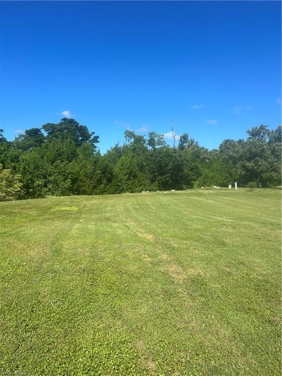 Great opportunity to build your Dream Home on this Oversized Lot in McGregor Mobile Manor. This lot is located in on water and has privacy as no one can build behind you.  Perfect community (55+) located near Sanibel Island, Fort Myers Beach, SW International Airport, Restaurants, Hospitals & Shopping. Amenities included Community Pool, Shuffle Board and Clubhouse. Very Low HOA feei is an added bonus.