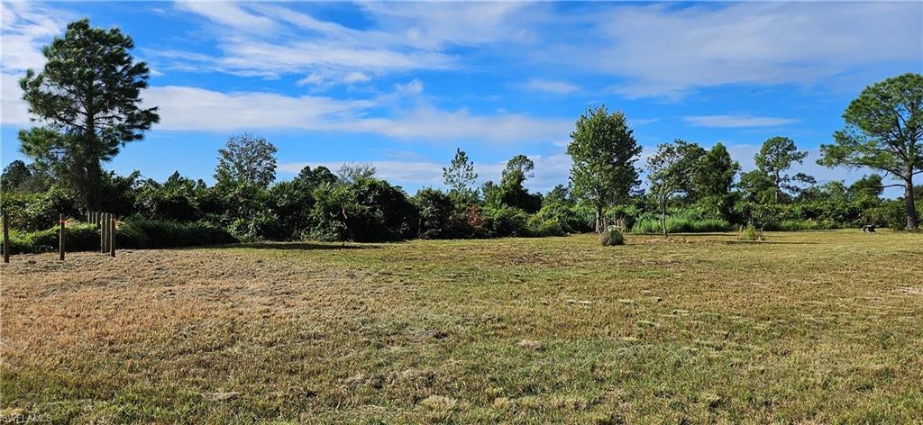 Motivated Seller! Enjoy the open feel and slower pace of country living on this 1.43-acre cleared property in LaBelle. Tucked away at the end of a dead-end street, it offers a peaceful setting with room to imagine your own plans for the land. Zoned for single-family homes or mobile homes. The property backs up to the fence bordering Lykes Brothers property, and power poles run along the rear. A survey and perc test are available, and an abandoned lime-rock road runs through the property. The seller notes the acreage may allow for a conventional septic system; buyers should verify septic options, permits, and intended use with the appropriate authorities.