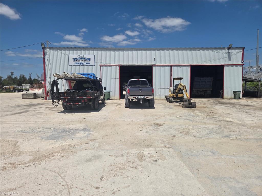 OWNER OCCUPIED AND A GREAT LOCATION FOR ANY BUSINESS IN THE TRADES THAT WOULD LIKE  TO BE NEAR THE WORK AREAS ALONG PINE ISLAND ROAD, SR-78.  ALMOST 2 ACRES OF LAND, MOSTLY PAVED WITH CONCERETE WITH A STEEL BUILDNG OF ABOUT 3,080 SQ. FT, WHICH HAS TWO LARGE TRUCK DOORS, GROUND LEVEL.  ZONED INDUSTRIAL AND IN THE COUNTY OF LEE.