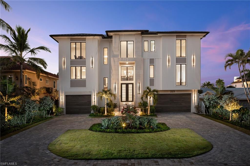BRAND NEW waterfront estate built to the highest standards of coastal construction, FULLY FURNISHED, and ready for immediate entertainment. Just steps from your own secluded beach access, luxury beach clubs, and a short boat ride to the Gulf right from the backyard. The home offers water views from nearly every vantage point and lives large with almost 6,000 square feet of air-conditioned space and spans nearly 11,000 total square feet. In a league of its own with the primary suite, great room, main kitchen, chefs’ kitchen, outdoor kitchen, outdoor living area, and pool all on one level and elevated 19 feet above sea level. 223 Bayview is an architectural masterpiece with a practical layout, high end material selections, and exceptional detail throughout. Featuring 6 large bedroom suites and 8 elegant bathrooms, all providing a unique living space and meticulously crafted to the finest detail. The expansive three-story open-floor plan also includes a separate living area featuring a massive top-floor club room with a full-service bar surrounded by 5 additional king-bed guest suites. This is the only home available with a must-have second floor custom designed pool which is equipped with a large spa, water features, fire features, and an infinity edge. Adjacent to the elevated pool is the outdoor kitchen and sitting areas which provide an exceptional venue for hosting guests and is equipped with roll down screens and hurricane shutters. Culinary enthusiasts will fall in love with the main kitchen and hidden full-service chef’s kitchen, both equipped with Wolf & Subzero appliances. Car collectors will appreciate the almost 2,500 square feet 8+ car drive-thru garage with plenty of height to add lifts for the largest of collections. You won’t find another home available with a whole home generator fueled by continuous NATURAL GAS to ensure peace of mind through any storm. 223 Bayview Avenue transcends the definition of luxury waterfront living on Vanderbilt beach with its superior design, finishes, and unrivaled proximity to several beach clubs including the Ritz Carlton Beach Resort, La playa Golf & Beach Resort, and the highly anticipated members only Paraiso Beach Club that is currently being constructed at the end of the street! This home offers a rare opportunity in one of Naples’ most coveted coastal locations.