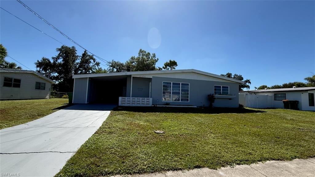 One or more photo(s) has been virtually staged, AI generated or rendered.  Fully remodeled 3 bedroom/1-bathroom home with a carport, fenced-in back yard, and a screened-in patio enclosure! Walk inside and see that this home has an open layout, new vinyl flooring throughout, all new lights and fixtures, new bathroom, vanity and a retiled shower. Newer kitchen with backsplash, cabinets, quartz countertops, and all newer stainless-steel appliances. Open layout and bonus room! NEWER 2022 ROOF and NEW 2023 HVAC!! Port Charlotte Beach Park (8 mins) offers waterfront recreation close to home, while nearby Punta Gorda brings waterfront dining, tiki bars, shopping, entertainment, historic charm and year-round events. Shopping, dining, medical facilities, parks and everyday conveniences are all within easy reach, with Punta Gorda Airport nearby and Sarasota and Fort Myers airports providing additional travel options. If you've been searching for an affordable home in Southwest Florida with major improvements already completed, extra storage, workshop space and no monthly HOA fees, this may be the opportunity you've been waiting for.