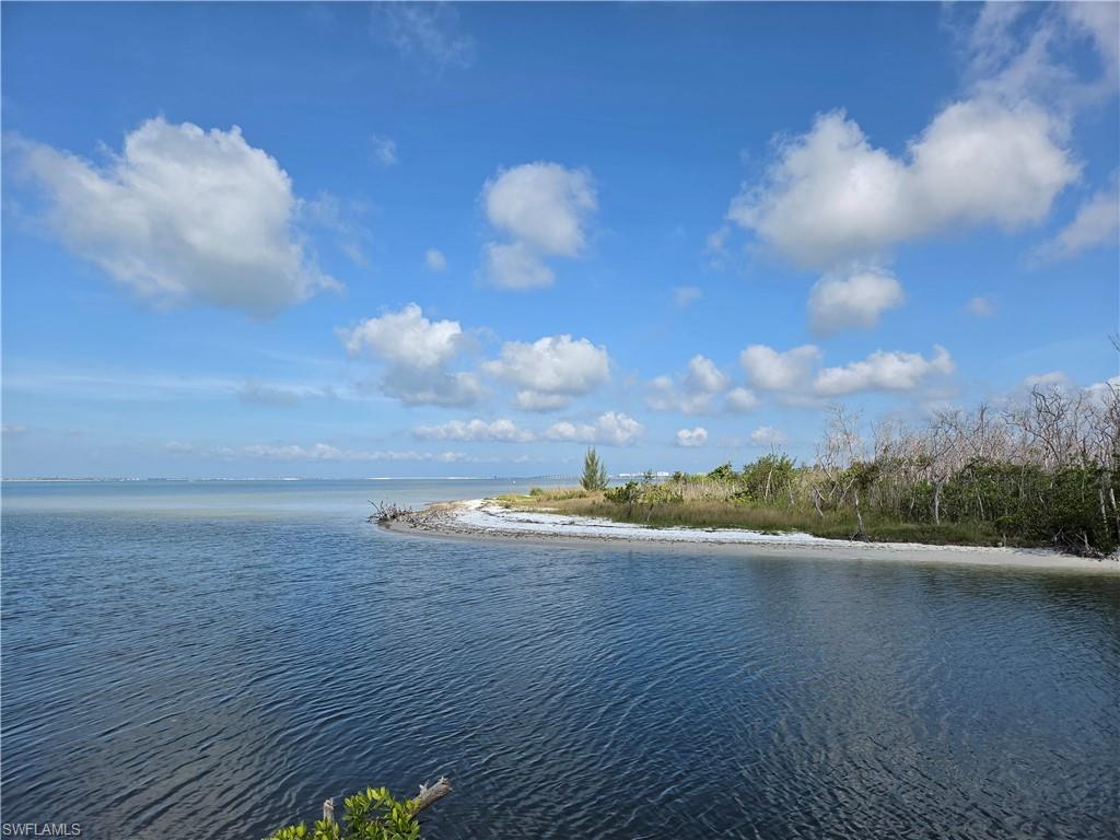 This newly developed Homesite 23, 1 of 24, in the exciting boating community of Old Pelican Bay Estate in Siesta Isle. Just minutes from the Gulf with no bridges in the way. The deep passage canal will accommodate larger boats with deep water to the San Carlos Channel to the Gulf. The buyer will be required to sign and build a Minimum 3000 AC square foot two story over garage home with the developer, Claussen Residential Communities . The lot is on the canal. The lot comes with dock rights. The street is a pervious brick paver. The developer has four plans for review and will do custom home