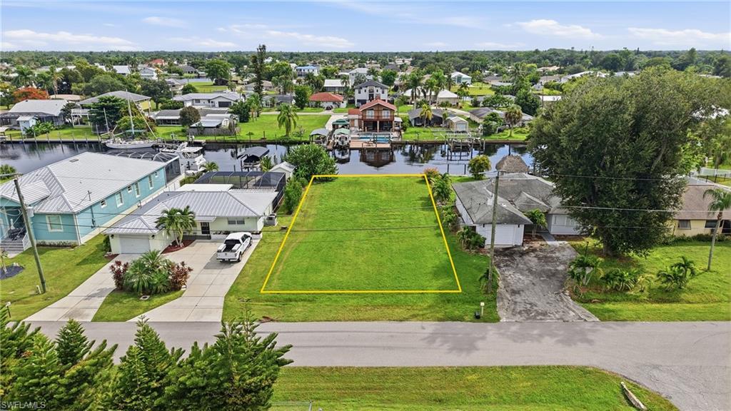 Build your Southwest Florida waterfront dream home on this exceptional vacant lot in Fort Myers Shores. Offering 60 FEET OF WATER FRONTAGE along a canal with an existing CONCRETE SEAWALL, this property provides an ideal setting for enjoying the boating and waterfront lifestyle. The canal is just minutes from the CALOOSAHATCHEE RIVER, providing easy access to some of Southwest Florida's most desirable waterways. Nearby waterfront properties in Fort Myers Shores highlight the area's direct Gulf-access boating opportunities and proximity to the river. Need a builder? Let us introduce you to reputable local builders.

WATERFRONT FEATURES

• 60 feet of water frontage
• Canal-front location
• Existing concrete seawall
• Minutes to the Caloosahatchee River
• Excellent opportunity to build a custom waterfront home

BUILD YOUR FLORIDA LIFESTYLE

Bring your vision and create a waterfront retreat designed around the Florida lifestyle. Enjoy boating, fishing, kayaking, or simply relaxing beside the water. The location offers the opportunity to enjoy the waterways while remaining close to the conveniences of Fort Myers.

LOCATION & AREA HIGHLIGHTS

Fort Myers Shores is a waterfront community along the Caloosahatchee River with convenient access to Downtown Fort Myers, shopping, dining, parks, and recreational opportunities. The nearby River District offers historic charm, waterfront views, restaurants, shops, galleries, and entertainment.

• Close to the Caloosahatchee River
• Convenient access to Downtown Fort Myers
• Near shopping and dining
• Close to waterfront parks and recreational areas
• Easy access to I-75
• Nearby Manatee Park and the Caloosahatchee waterfront
• Convenient to the historic Fort Myers River District

Whether you're ready to build your forever home, seasonal retreat, or investment property, this 60-FEET OF WATERFRONT offers an opportunity to create your own piece of Southwest Florida.