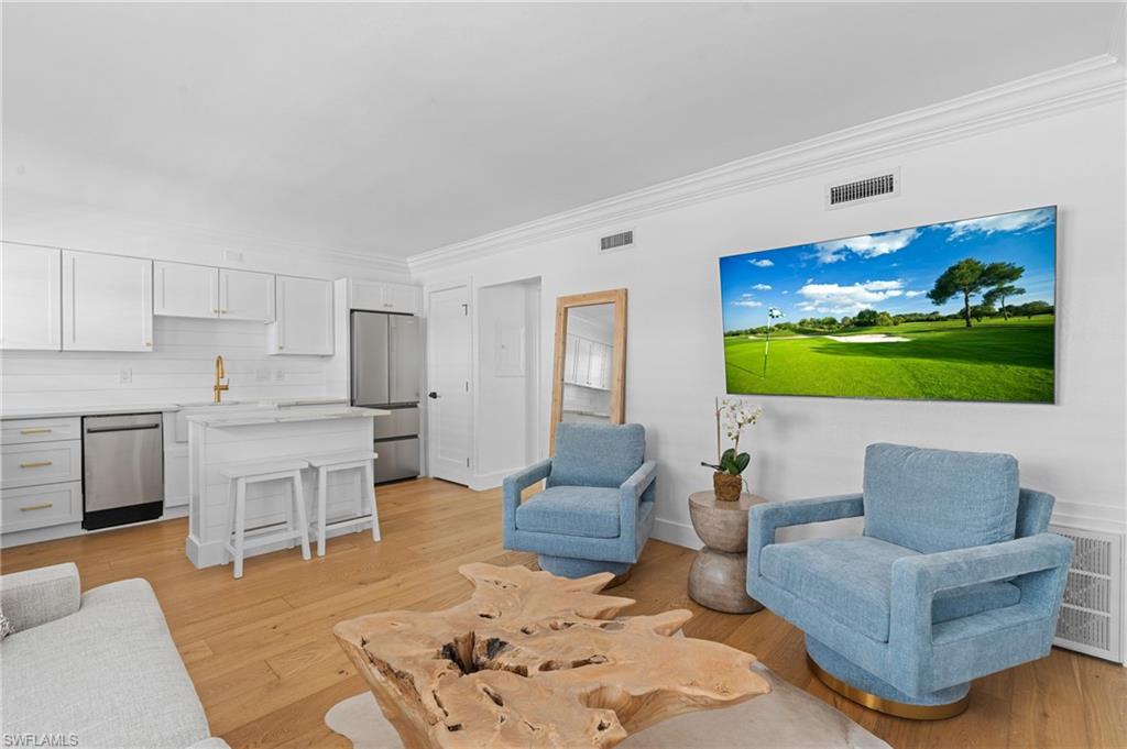 Welcome to this beautifully renovated first-floor condo in Castleton Gardens, ideally located in the vibrant downtown district of Olde Naples. This stylish condo features stunning white oak floors, brand-new appliances, a new HVAC system and water heater, and quartzite countertops. Just steps from the iconic 5th Avenue South, Naples Bay, Tin City, Third Street South, Cambier Park, and the Arthur L. Allen Tennis Center, you'll find the finest dining, shopping, arts, boating, and pristine Gulf beaches right outside your front door. Castleton Gardens is a quintessential boutique community offering a resort-style pool, spa, grilling area, and additional storage options. Residents enjoy ample off-street parking, gated secure entry, and a pet-friendly environment. Whether you're seeking a perfect Olde Naples pied-à-terre or a savvy investment opportunity, this condo delivers—with the ability to rent 12 times per year, each for a minimum of 30 days. Don’t miss this exceptional opportunity to own a piece of paradise in one of Naples' most sought-after neighborhoods!