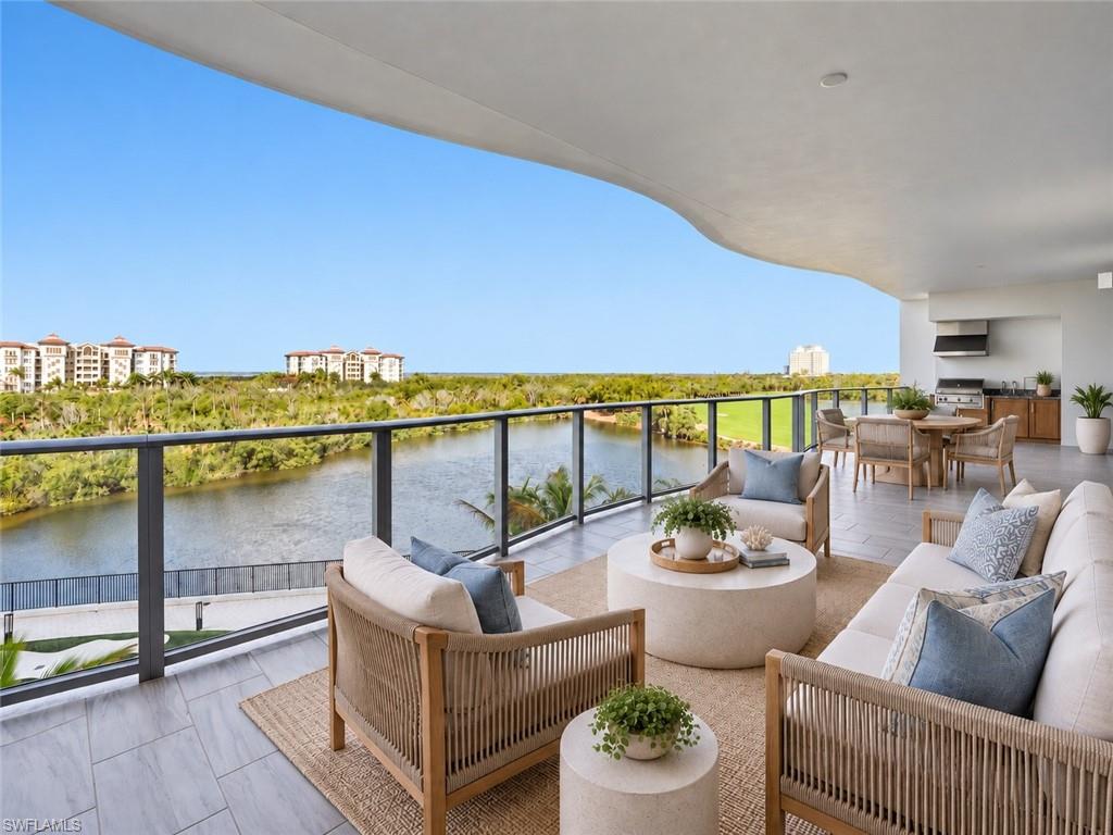 One or more photo(s) has been virtually staged, AI generated or rendered.  Welcome to a newly completed residence in Infinity at The Colony, where refined coastal living meets one of Southwest Florida’s most sought-after luxury communities. This light-filled home showcases tranquil water views through expansive walls of glass, creating a seamless connection between indoor and outdoor living. A private elevator entry opens to a spacious open-concept floor plan highlighted by soaring ceilings and clean architectural lines. The great room and dining areas flow effortlessly to the outdoor living spaces, creating an ideal setting for both everyday comfort and elegant entertaining. At the heart of the residence, the kitchen features premium finishes, gas cooking, generous workspace, and a layout that integrates beautifully with the main living areas, allowing the host to remain part of every gathering. Ten-foot sliding glass doors open to an oversized lanai with a built-in grill—perfect for morning coffee, sunset dining, and enjoying the coastal breezes that define Southwest Florida living. Residents of Infinity enjoy an exceptional amenity collection including multiple resort-style pools, a poolside restaurant, members’ lounge, game room, and a state-of-the-art fitness center. Recreational highlights include pickleball courts and a putting course designed by acclaimed golf architect Beau Welling. Owners also enjoy the exclusive lifestyle of The Colony at Pelican Landing, including access to a 34-acre private island beach park, tennis and pickleball facilities, canoeing and kayaking, and the renowned Bay Club, offering exceptional waterfront dining overlooking Estero Bay. Ideally located near world-class dining, shopping, and entertainment, and just 20 minutes from Southwest Florida International Airport, this residence offers the perfect balance of luxury, privacy, and resort-style living.