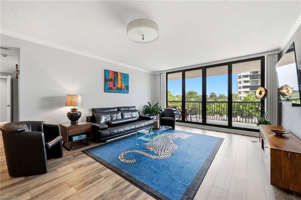 HOTEL-INSPIRED RETREAT AT THE DORCHESTER
Experience refined coastal living in this beautifully renovated second-floor residence at The Dorchester, an intimate, concierge-style high-rise with only 86 residences in prestigious Pelican Bay. Offering approximately 1,741 square feet, this sophisticated condominium features two spacious en-suite bedrooms, two-and-a-half baths, and a light-filled, living and dining area designed for relaxed living and effortless entertaining.
The serene coastal-inspired interior flows seamlessly onto an expansive private balcony overlooking the resort-style pool and lush tropical landscaping. The beautifully appointed kitchen features stainless steel appliances, granite countertops, abundant cabinetry, a walk-in pantry, and a charming breakfast area.
Additional highlights include impact-resistant windows and sliding doors, a newer air-conditioning system, assigned garage parking, and a large air-conditioned storage room conveniently located just outside the residence. The Dorchester has undergone extensive renovations and offers the added benefits of a newer roof and a backup generator.
Residents enjoy exceptional amenities, including attentive concierge services, guest suites, a fully equipped fitness center, a sophisticated social room with a bar and full kitchen, a resort-style pool and spa, fire pits, barbecue and picnic areas, and bicycle storage. A tram stop conveniently located behind the building provides easy access to Pelican Bay’s private beachfront, approximately one-third of a mile away, where residents enjoy beach chairs and umbrellas, beachfront dining, and miles of pristine Gulf shoreline.
More than a residence, this is a sophisticated coastal sanctuary offering the privacy of a boutique building and the exceptional lifestyle of one of Naples’ most prestigious communities.