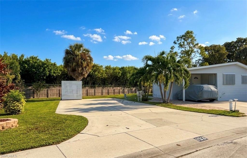 Fantastic opportunity for an attractive lot situated within a 55+ community in Naples, FL that was never flooded, and the residents own their land (it is not a co-op or lease). This particular paved lot features full hookup (water, sewer, electrical) and can accommodate a 40’ (maximum) RV or manufactured home. On the lot, there is a storage shed with shelves. The rear of the lot faces northwest and features a grassy area. Imperial Wilderness Condominium Association is approximately 3 miles to shopping and restaurants, 11 miles to Naples beaches, and 8 miles to Marco Island beaches. Plus, airport access is easily attainable—a 45-minute drive (RSW). Maximizing your opportunity of affordably owning land in Naples, Florida, the HOA fee ($898. per quarter) is exceptionally reasonable. That fee covers many of your needs: the advantage of a gated community, water, sewer, lawn care, basic cable, trash, recycling, and community amenities. Community amenities include 2 pools with spas, bocce, pickleball, pétanque, tennis, shuffleboard, billiards, ping pong, a library, clubhouse, 2 dog parks (pet allowance–1 pet, 40lb. max.), and a nature trail. This community also allows electric golf carts. On top of this, there is an extremely active events calendar.