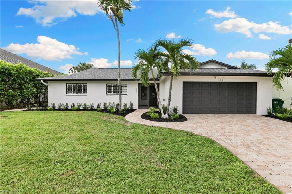 Start your morning with coffee by the pool, spend the afternoon at the beach, and end the day enjoying dinner and everything Marco Island has to offer. This 3-bedroom, 2-bath pool home offers a comfortable setting for everyday island living, ideally located just 0.3 miles from the beach. Inside, the spacious living area opens toward the outdoor space, creating an easy flow for everyday living and entertaining. The kitchen features rich wood cabinetry, granite countertops, stainless steel appliances, and plenty of storage, while the adjoining dining area provides room to gather after a day in the sun. Outside, the screened pool becomes your own private retreat, surrounded by mature tropical landscaping that adds privacy and a relaxed island atmosphere.
What truly sets this home apart is its location. With Marco Island’s beautiful white-sand beach just 0.3 miles away, days by the Gulf and sunset walks can easily become part of your everyday routine. Popular restaurants, shopping, boating, and entertainment are also nearby, putting more of the island lifestyle within easy reach. Whether heading out for a morning on the Gulf, coming home for an afternoon swim, or catching one of Marco Island’s unforgettable sunsets, this home makes it easy to enjoy more of what you came to the island for. With a two-car garage, inviting outdoor living, and a central island location, this is an opportunity to make the Marco Island lifestyle part of every day.