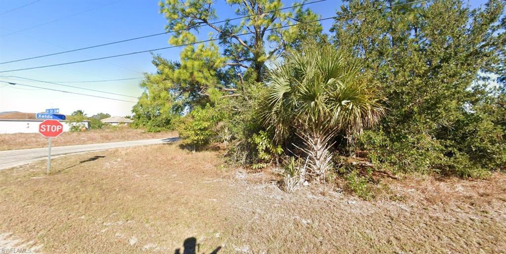 Build your Florida dream home on this desirable 0.25-acre corner residential vacant lot in Lehigh Acres, offering a great opportunity for homeowners, builders, or investors. Conveniently located with access to a paved road and electricity available, this property provides a solid starting point for your future construction plans. Enjoy the opportunity to create your own space in an established Florida setting, with nearby residential properties, local amenities, shopping, dining, and everyday conveniences within reach. Don't miss the chance to secure your piece of Florida real estate!