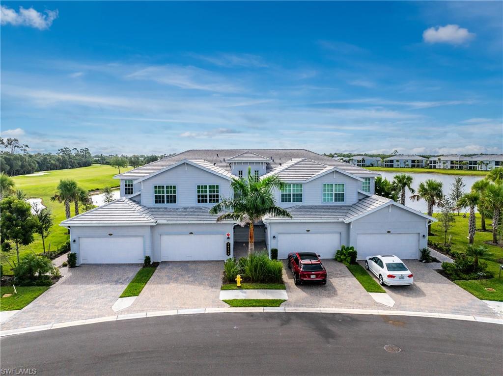 Heritage Landing is another premium Lennar gated bunded golf community on the exploding Burnt Store corridor. Just minutes from charming downtown Punta Gorda and just north or Ft Myers and Cape Coral, Heritage Landing offers something for everyone. The included Social Membership includes, tennis, pickleball, fitness center multiple pools, 2 restaurants, spa, etc...With condos, coach homes and single family homes there is great variety in home styles. The coach home offers a perfect blend of condo and single family home living. This coach home offers low density with only 4 homes per building yet offers the coveted 2 car garage and a generous footprint of nearly 1800 sq'. Add to that a large private screened lanai with incredible views and you have the perfect vacation home. UNIQUE, UNIQUE, UNIQUE, is this homes highlight! Finding privacy in a condo or coach home can be very challenging. Unit 4011 offers special features including no coach homes across the street which means no congestion on the street and another wonderful lake view from the front of your home. Come out back and enjoy one of the largest lake views in the community, actually 2 lakes! Add to that a view of the 18th fairway which is special. Best of all the orientation of the neighboring building offers a sweeping 180 degree view from your lanai and a very unique sense of privacy. Please take the time to see it for yourself. The unit is 2 years old and shows as new including upgraded lighting and tile floors throughout! No carpeting!