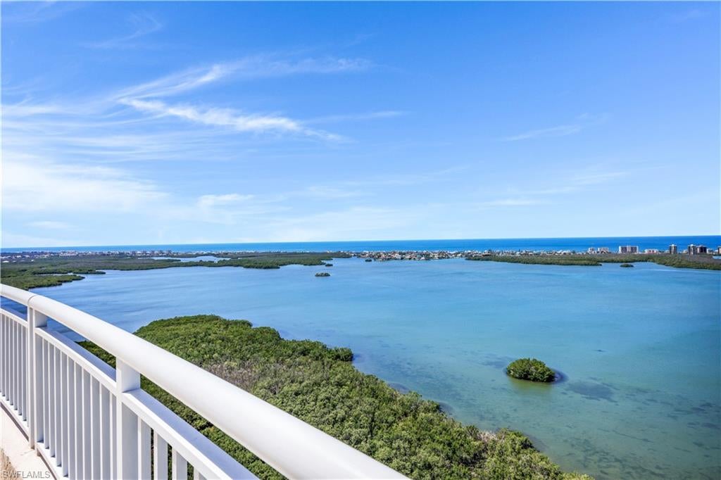 Welcome to your very special 14th floor residence in the sky. When you enter the home from your private elevator foyer, you will enjoy the many high quality finishes. This rarely available “03 unit” offers spacious 3 bedrooms, 3 baths, living room with a fireplace, large kitchen/breakfast bar.  A large master bedroom suite with a private bath. There are two (2) additional guest bedroom suites, each with a private bath. You will be stunned by the amazing views of the glistening waters of Estero Bay and the Gulf. Enjoy the dramatic and ever changing sunsets from two of the three outdoor terraces. For your alfresco dining, the screened-in outdoor kitchen features gas grill, sink and electric storm shutters. Two (2) interior parking spaces are included.  AZURE is one of Bonita Bay’s premiere luxury high rises with many amenities--a LIVE-IN resident manager, a/c storage units, beautiful roof top terrace w/bar and gas grill, resort style pool with screened-in cabana w/ fireplace, poolside gas grill, outdoor fire pits, fitness room, social/card rooms, billiard room, (2) guest suites, men's and women’s spa and media room with movie/sports package.