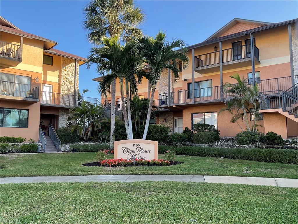 Clam Court Marina with a 30' BOAT DOCK and gulf access nestled in the desirable Royal Harbor area on a quiet cul-de-sac and just minutes away from the downtown area provides easy access to shopping, dining and entertainment. Enjoy nearby hot-spots such as Tin City, Bayfront, 5th Avenue South, Naples Pier, the Gulf, Celebration Park, the Botanical Gardens and Baker's Park - all just minutes away. This second floor, two-story condo features 2 bedrooms and 2.5 baths, which overlooks the water. One screened-in lanai is located on the first floor level, as is the main living area, dining area, kitchen and laundry. The second screened-in lanai is on the upper level off of the primary bedroom. The community room, which has a kitchen is located off the pool and overlooks the water. You can relax and enjoy the heated salt water pool while having a BBQ.