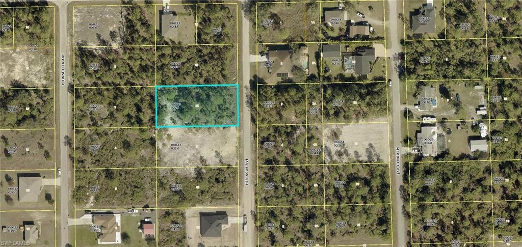 HALF ACRE residential building lot on a nicely paved street, large newer homes in the area, excellent location just minutes to I-75, Ft Myers and SWFL International Airport.