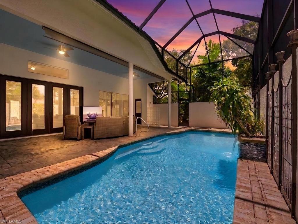Estate single family pool home on one of the largest lots in the community of Hampton Greens/Gateway. Recent updates include NEW Train A/C in 2025, updated tile flooring, NEW metal roof in 2019, fresh exterior paint, fenced in back yard and new lanai cage & screens. Custom-built home w/ luxury features throughout-  gourmet kitchen w/ breakfast bar, formal dining area, breakfast nook, split bedroom floor plan, side facing 2-car garage and extended driveway, volume ceilings w/ crown molding, beautiful glass door entry w/ side lights, French doors to lanai in living room, transom windows, luxury vinyl flooring in main living area, spa therapy system in master suite shower, lots of natural lighting, massive pool lanai w/ pool bath, large open lanai in fenced-in area of backyard that is ideal for a sports court or fire pit, and tropical landscaping on the half acre parcel. Meticulously maintained home w/ plenty of room for the entire family w/ a sprawling split bedroom layout and outdoor living space that is perfect for enjoying the SWFL sun! Situated in the gated community of Gateway Greens and inside the gates of the highly desired Estate Home subdivision of Hampton Greens. You will be within walking distance to The Club @ Gateway that offers optional golf & social membership w/ resort-style amenities. Gateway has everything you could ever want - golf, tennis, volleyball, tennis, pickleball, walking paths, restaurants, entertainment, & so much more. Just a short drive to the Spring Training fields of the Red Sox and the Twins, plus only minutes from RSW Airport.