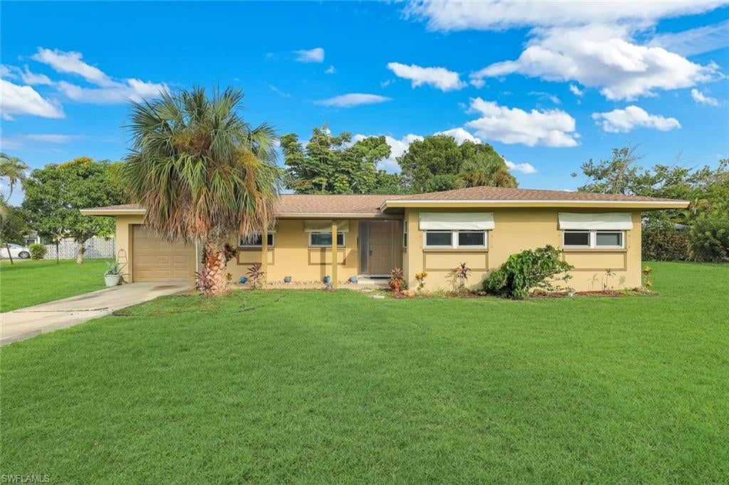 OPPORTUNITY AWAITS IN SE CAPE CORAL! Situated on an oversized triple lot in a highly desirable SE Cape Coral location, this 3-bedroom, 2-bathroom home with a 1-car garage offers plenty of potential for the right buyer! Whether you're looking for a place to make your own or an investment opportunity, this property provides a great foundation to bring your vision to life. The home features tile flooring throughout the main living areas, laminate flooring in the primary bedroom and one guest bedroom, and terrazzo flooring in the third bedroom. A new roof was installed in 2023, and the property is connected to city water and sewer with all assessments PAID! Outside, the spacious triple lot offers plenty of room to enjoy the Florida lifestyle, complete with established landscaping featuring a variety of mature trees and shrubs. While the home could benefit from some updates and TLC, the combination of its generous lot size, desirable location, and important existing improvements makes this a fantastic opportunity! Conveniently located just a short drive from RSW International Airport, beautiful Southwest Florida beaches, shopping, dining, and everything the area has to offer. Bring your imagination and discover the possibilities!