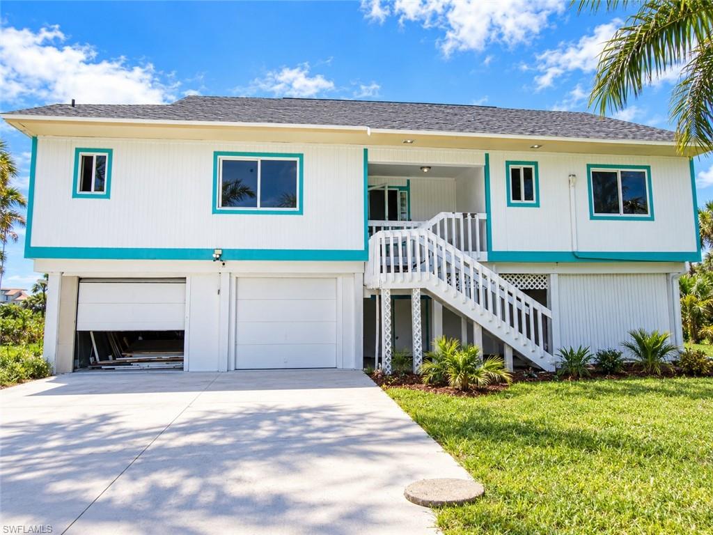 INCREDIBLE SANIBEL ISLAND OPPORTUNITY! Bring your imagination and finish what has already been started! This spacious 3-bedroom, 3-bath home with a 2-car garage and pool is located within walking distance of the beautiful Sanibel beaches and offers tremendous potential. A major renovation was started but not completed, giving the next owner the opportunity to finish the home to their own taste and vision. Significant improvements already in place include a NEW ROOF, NEW WINDOWS AND SLIDING GLASS DOORS, large-format tile flooring, a contemporary kitchen renovation in progress, and beautifully updated baths featuring impressive floor-to-ceiling tile work. The open interior design features vaulted ceilings, abundant windows and sliding doors, and plenty of natural light. Enjoy peaceful WATER VIEWS from the home and expansive outdoor areas. The elevated design provides a large amount of space below and the property offers TONS OF ROOM AND POTENTIAL FOR EXPANSION, outdoor living and entertaining. With many of the major improvements already started, this is a unique opportunity to complete a custom Sanibel Island home exactly the way you want it. Pool, water views, garage, spacious homesite and a location within walking distance of SANIBEL BEACH—bring your contractor, your plans and your imagination!