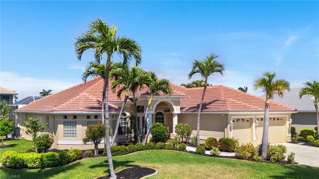 Welcome to your dream home in Cape Harbour, where luxury, comfort, and coastal living come together in perfect harmony. Nestled within one of Southwest Florida’s most prestigious waterfront communities, this stunning pool home offers the ideal blend of elegance and ease. Known for its scenic canals and direct Gulf of Mexico access, Cape Harbour is a paradise for boaters and water enthusiasts alike.

As you arrive, you’ll be captivated by the curb appeal of this expansive 4-bedroom + den, 3.5-bath, 3-car garage residence, offering over 5,000 square feet of indoor and outdoor living space. Step through custom etched glass French doors into a grand formal living area where soaring ceilings and sliding glass doors frame views of the pool and canal. A built-in wet bar with a beverage refrigerator makes entertaining effortless.

The updated kitchen is a chef’s delight, featuring shaker-style cabinetry, a custom range hood, tile backsplash, granite countertops, stainless steel appliances, a pantry, and a large center island perfect for gatherings. The kitchen opens seamlessly to a bright eat-in area and spacious family room, where disappearing sliding glass doors invite the outdoors in and fill the space with light and tranquil waterfront views. The home also features a formal dining room, a versatile den or home office, and a stylish half bath for guests.

The primary suite is a private retreat, featuring new plank tile flooring, a tray ceiling, a generous sitting area, and private pool access through an etched glass door. Wake each morning to water views and unwind in the spa-inspired bath, complete with two walk-in closets, an oversized soaking tub, dual vanities with new sinks, and a walk-through shower with a teak seat.

The guest bedrooms are equally inviting, with two sharing a Jack-and-Jill bath and the third enjoying a private ensuite that also serves as the pool bath. All guest rooms feature wide plank tile flooring, and two have walk-in closets.

Step outside to the oversized screened lanai, which spans the full length of the home and offers ample space for lounging, dining, and entertaining under the Florida sun. A short stroll takes you to your private composite boat dock, where you’re just minutes from open water—perfect for boating and fishing.

Recent updates include a new roof ('23) and new AC system '(24), providing peace of mind and long-term value. Located on a quiet cul-de-sac, this home also offers access to Cape Harbour’s resort-style amenities, including a marina, pools, fitness center, and a vibrant social scene. Stroll through the walkable waterfront village, featuring boutique shopping, waterfront dining, live music, and spectacular sunsets—all just steps away.

This home is being sold turnkey and includes a transferable flood policy, so you can move right in and start enjoying the Florida sunshine. More than just a residence, this is a lifestyle—where every day feels like a vacation!
