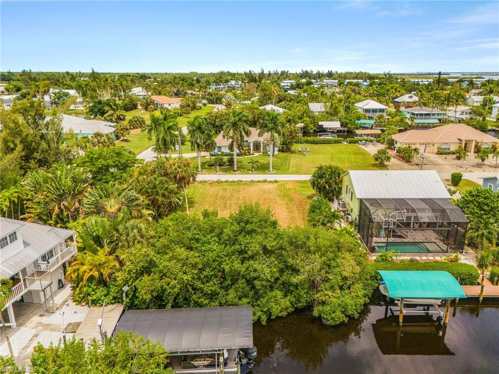 Build your dream island home on this oversized, cleared waterfront lot in the beautiful  Serenity Cove community of Bokeelia. With DIRECT GULF ACCESS and no bridges, this property offers the laid-back Pine Island lifestyle for boaters, anglers, and anyone who dreams of living on the water. This waterfront location puts an incredible array of boating and recreational destinations right at your doorstep. From your own backyard, cruise to Cayo Costa, Sanibel, Cabbage Key, and other popular island destinations, with easy access to world-class fishing, pristine beaches, and open Gulf waters. A short car or boat ride brings you to Jug Creek Marina. With no HOA restrictions, you have the freedom to design and build the coastal retreat you’ve always envisioned. Enjoy the privacy and flexibility of an oversized cleared lot. Bring your boat, bring your plans, and start building your Pine Island dream in Serenity Cove!