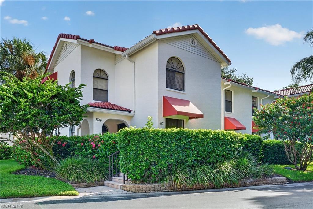 Tucked along a quiet drive in Serendipity, this three-bedroom, two-bath end-unit offers the ease of single-level living within one of North Naples' most coveted coastal enclaves. A full renovation and a thoughtful run of recent improvements leave little to do but move in. Tile flows throughout the split-bedroom plan, and the crisp white kitchen with quartz counters opens gracefully to the great room and a screened lanai framed by lush, landscaped grounds. This home is in an X-Zone so no hurricane worries here. The care shows in the details that matter most. A new tile roof and electric storm shutters were added to the lanai in 2024, and a top-of-the-line Romeo Air Infinity system with an Air Knight UV air purifier was installed in 2022. A whole-house reverse osmosis system from Aztec Plumbing followed in 2025. The primary suite is finished with dual sinks and a walk-in shower, and the second bath offers both a tub and shower. A private storage unit and an assigned covered carport add everyday ease. Beyond the door lies the full rhythm of Pelican Bay living, with private beach access, beachfront dining, attended fitness, tennis and pickleball, and miles of bike and jog paths winding through the mangroves. The community pool and spa sit just steps away, while Artis Naples, Waterside Shops, and the shoreline are all moments from home.