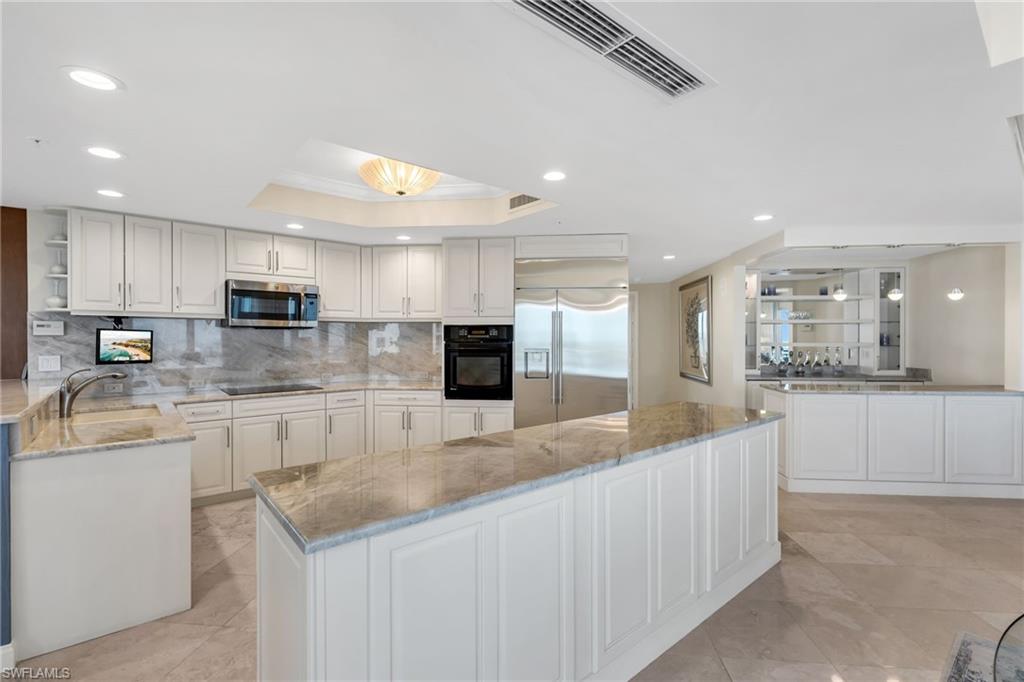 This beautifully decorated 21st floor, three bedroom plus den residence features an open and split floorplan and has been refurbished and luxuriously furnished by Collins & Dupont.  Floor to ceiling sliding glass doors open the living room to a screened terrace with uninterrupted west facing views over the Estero Bay and the Gulf of Mexico—the perfect vantage point to enjoy spectacular sunsets.  The dining and morning rooms also showcase floor to ceiling windows with long, wide water views.  Additional features include two under building parking spaces and a separate air-conditioned storage area.  Estancia offers exceptional amenities including a live in manager, two guest suites, fitness center, massage room, social room, card room.  There is an expansive pool deck with lake and golf course views with a large pool, spa, fire pits, covered social area with outdoor grilling and water feature.  Located within Bonita Bay, a 2,400 acre community with miles of walking/biking trails, natural preserves, 3 parks, 5 golf courses, 18 court tennis center, 18,000 sf fitness center, 8,000 sf spa and salon, full service 80 slip marina with dry storage and boat club, newly built Gulf front beach park, six restaurants, 15 pickleball courts, croquet lawn, bocce ball, canoeing, and a life enrichment center hosting many clubs.