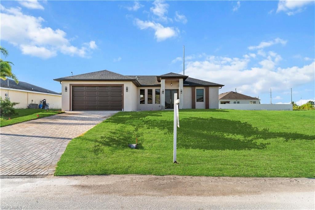 Experience the essence of modern luxury in this stunning 2026 new construction home located in the heart of Northwest Cape Coral.Designed with sophistication and functionality in mind, this residence combines elegant architecture, high-end finishes, and cutting-edge smart-home technology.
From the moment you step inside, you’ll be captivated by its open-concept design, soaring ceilings, and natural light that fills every corner. The porcelain tile floors and modern chandeliers set a refined tone throughout the home.Featuring two fully equipped gourmet kitchens, this property is perfect for those who enjoy entertaining or value versatility for guests and family. Every detail reflects quality — from the custom cabinetry and stainless-steel appliances to the spacious master suite with a spa-style bathroom.Nestled in one of Cape Coral’s most desirable and fast-growing areas, this home offers the perfect balance of luxury and convenience. Enjoy being close to top-rated restaurants, hotels, parks, and navigable canals, embracing the true Florida lifestyle?• Two full kitchens with premium finishes and 2 1/2 bathroom.?? Live the modern Cape Coral lifestyle — where elegance meets innovation
