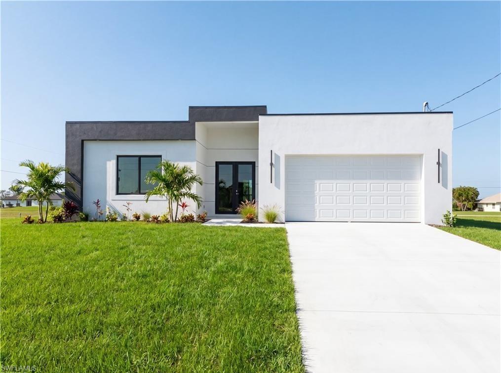 Beautiful Lot home, make it yours now! Bright and spacious property in a prime location, offering a peaceful residential setting with quick access to green areas and outdoor recreation. Discover this stunning, move-in-ready new construction home offering 1,904 sq ft of living area located in the fastest-growing area of Cape Coral. Featuring a sleek contemporary layout with 10-foot ceilings and elegant tile flooring throughout, this residence boasts 4 spacious bedrooms and 3 stylish bathrooms. Enjoy a gourmet kitchen with white cabinetry, quartz countertops in both the kitchen and bathrooms, and stainless steel appliances. Bathrooms feature frameless glass-enclosed showers/bathtubs, adding a luxurious touch. A washer and dryer are also included for your convenience. The open floor plan seamlessly connects living, dining, and kitchen areas, while the private backyard offers a peaceful retreat. Built with Stem Wall foundation for enhanced elevation and structural strength, this home also features impact-resistant windows and doors, automatic garage door, irrigation system, and high-end finishes throughout. This property is ideal for families, snowbirds, or investors. Plus, it includes a builder’s warranty 2-years and 10-year structural coverage offering peace of mind for years to come. Don’t miss this incredible opportunity to own a high-quality home in a booming location!-WITH SHELVES, FILTER AND BLINDS