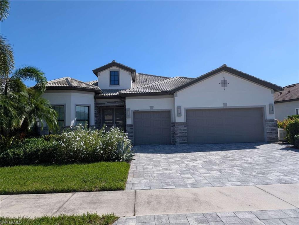 Professional Pictures coming soon! Masterfully customized by Clive Daniel Design, this exceptional Stonewater estate in Corkscrew Shores represents the ultimate in hassle-free luxury, offered as a FULL TURNKEY, fully furnished including all accessories and kitchen items (brand new), sheets, towels.... Tucked away on a quiet cul-de-sac street, this three-bedroom plus den, three-full-bath residence features a spacious 3-car garage and is perfectly positioned on an oversized lot, offering a private lake and preserve view with absolute privacy and no homes behind. Exterior & Resort-Style Outdoor Living: • Private Oasis: Features a spectacular custom heated saltwater pool and fully equipped custom outdoor kitchen, perfect for premium outdoor entertaining against a serene, private natural backdrop. Porcelain tile for easy maintenance (no weeds coming through). Panoramic screens. Custom wood ceiling. In-ceiling Sonos. Lighting system. • Exceptional Curb Appeal: Showcases a stone-accented exterior, a RARE GRAY paver driveway, custom landscaping, integrated driveway/landscape lighting, and a freshly painted exterior (2022). • Complete Storm Protection & Power Resilience: Equipped with whole-house impact windows, impact-rated doors, a custom impact front entry, buried gutter downspouts, and a whole-house backup generator powered by a buried propane tank. New automated Kevlar roll-down screens to protect your furnishings in the lanai. Interior Appointments: • Designer Finishes: Volume 12-foot ceilings, architectural tray ceilings, solid-core 8-foot doors, crown molding, custom window casings, and custom lighting. • Premium Flooring: Large-format tile spans the main living areas and bathrooms, while Italian ebony-stained wood floors warm all bedrooms and the den. • Great Room Showcase: Highlighted by a coffered ceiling and a custom stone feature wall with an integrated fireplace, 85” TV, and floating shelves with built-in lighting. • Chef’s Kitchen: Features white shaker cabinetry, a contrasting island, quartz countertops, a marble backsplash, premium KitchenAid appliances with a built-in refrigerator, a custom walk-in pantry, and a striking custom glass wine wall. • Smart Home Technology: Whole-house audio with IN-CEILING SONOS speakers, custom soundbars, Wi-Fi extenders, and motorized blinds on programmable timers in all bedrooms and the den. Central vacuum. New Wi-Fi thermostat for snowbird convenience. • Primary Retreat: A spacious suite with a spa-like bath featuring a tiled vanity wall, custom mirrors, an extended walk-in shower with floor-to-ceiling tile, and a custom walk-in closet with built-ins. large safe. Note: This property is sold fully furnished and turnkey. Custom Clive Daniel wall coverings and window treatments and lighting are included.