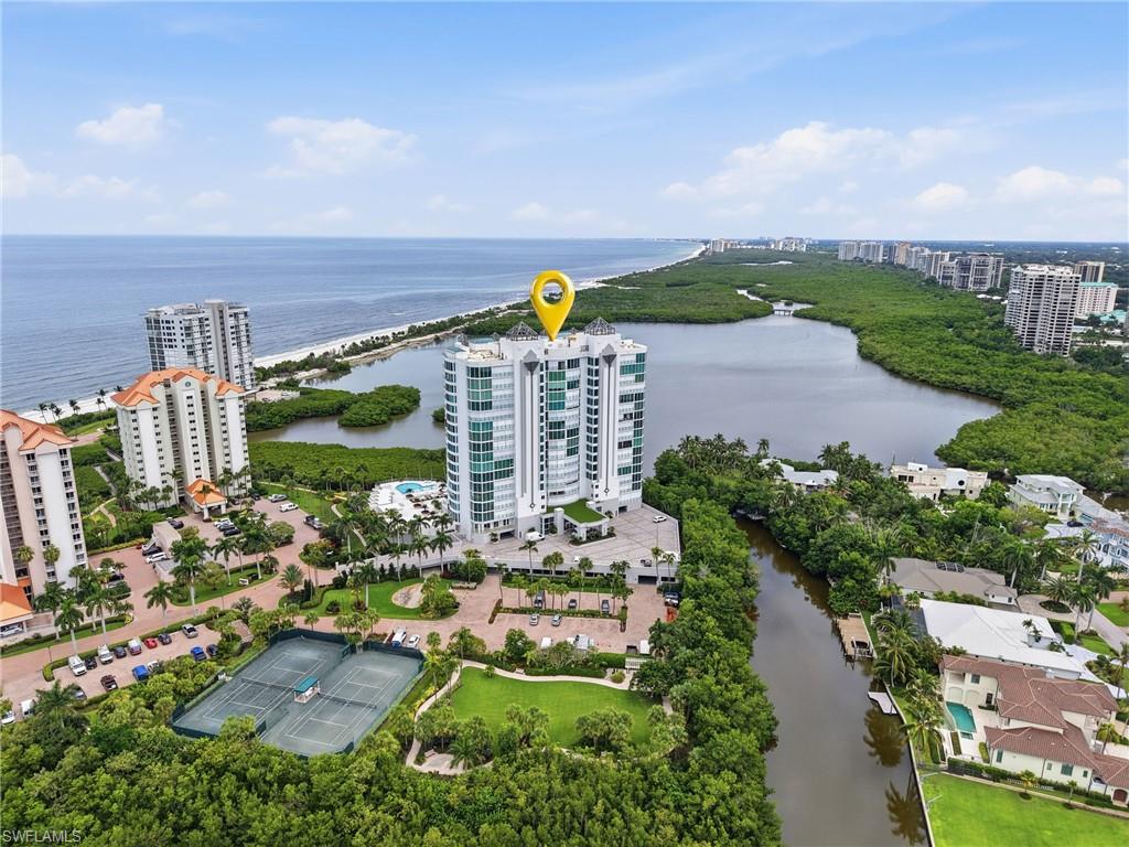 One or more photo(s) has been virtually staged, AI generated or rendered.  The pinnacle of refined coastal living from this exceptional corner residence at Baypointe in prestigious Naples Cay, where sweeping Gulf and Bay views create a spectacular backdrop for an unparalleled Naples lifestyle. Offered Furnished and ready to move right in, this sophisticated three-bedroom plus den, three-bath residence combines generous living spaces, privacy, and breathtaking waterfront vistas in one of Naples' most coveted beachfront communities.

The desirable corner location captures an abundance of natural light and offers multiple perspectives of the surrounding waters, allowing the beauty of the Gulf and Bay to become an integral part of everyday living. The thoughtfully designed floor plan provides exceptional flexibility with three spacious bedrooms and a versatile den, ideal as a private office, library, or additional living space.

Elegant living and dining areas create an inviting environment for both intimate evenings and sophisticated entertaining. Expansive windows showcase the ever-changing coastal scenery, from brilliant morning light across the water to spectacular Gulf sunsets. 



Life at Naples Cay is defined by an impressive collection of amenities designed to complement its extraordinary beachfront setting. Residents enjoy private beach access, providing an effortless connection to the sugar-white sands and Gulf waters, along with a resort-style community pool and spa for relaxing at home.

For recreation and wellness, the community offers tennis courts, a fitness room, billiards, and bike storage. Social and entertaining spaces include private cabanas, BBQ and picnic areas, and guest rooms, creating an inviting environment for gatherings with family and friends.

A dedicated covered parking space provides secure and convenient parking while protecting your vehicle from the elements.

Beyond the gates of Naples Cay, enjoy immediate access to the best of Naples—from pristine Gulf beaches and waterfront dining to world-class shopping, acclaimed restaurants, cultural attractions, and the vibrant lifestyle of Park Shore, Venetian Village & Waterside shops.