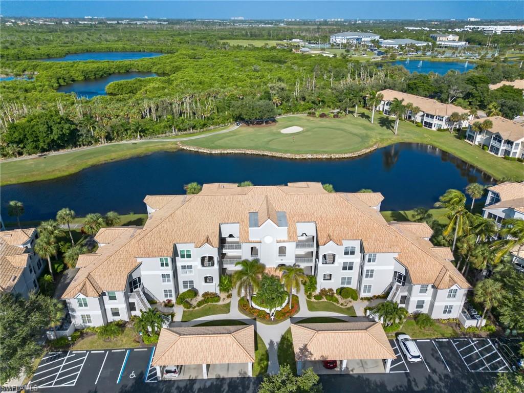 Enjoy stunning waterfront sunsets and one of the best views of Lexington Country Club’s signature 14th golf hole. This second-floor condo features 2 bedrooms, 2 baths, and over 1,200 s/f of living space, with tile and wood flooring throughout. Several sliding glass doors fill the home with natural light and open to an extended lanai overlooking the water and golf course. The functional kitchen includes a built-in desk and a new dishwasher installed in October 2026. Split bedrooms offer privacy and quiet, while a Murphy bed adds versatility to the guest room. Electric storm shutters provide protection and peace of mind. Lexington Country Club is a bundled golf community with exceptional amenities: world-class golf, a full-service restaurant and bar, a clubhouse pool and six additional pools, a Tiki bar, tennis, pickleball, a fitness center, bocce courts, and more. Welcome HOME!