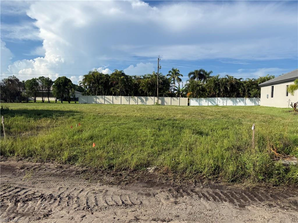 Build your Florida dream home on this *PRIME VACANT LOT* with *SOUTHWEST REAR EXPOSURE* located in the highly desirable and rapidly growing NW quadrant of Cape Coral! Perfectly positioned in a quiet, modern neighborhood, this high-demand building site features *CITY WATER & SEWER UTILITY ASSESSMENTS PAID!*. Located in close proximity to Pine Island Rd and the future Seven-Islands project.