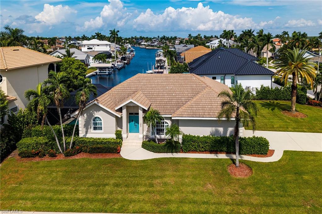 Welcome to this beautifully maintained waterfront home, offering the ideal combination of comfort, privacy and Florida outdoor living. The desirable split bedroom floor plan provides a private retreat for the primary suite, separated from the additional bedrooms for added privacy and flexibility for family and guests.
The home has been thoughtfully maintained and features numerous recent updates, including a newer roof, newer A/C, fresh interior paint, and a newer water heater. 
Step outside and enjoy your own private waterfront oasis. The composite dock with boat lift makes boating and enjoying Southwest Florida's waterways easy and convenient. The lanai offers a comfortable outdoor space for relaxing poolside, entertaining or enjoying the beautiful Florida weather.
Inside, the home offers a comfortable and functional layout with the primary bedroom thoughtfully separated from the guest bedrooms. Whether you're looking for a full-time residence, seasonal getaway or waterfront retreat, this property offers the lifestyle you've been waiting for.
With its private waterfront setting and boating amenities, this home is ready to be enjoyed. Come see all that this well-maintained Florida home has to offer!