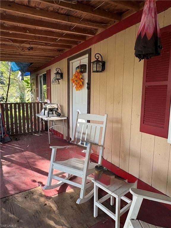 Enjoy rural living on this completely fenced property featuring a 3 bedroom, 2-bath mobile home with air conditioning. With almost 4½ acres, there's plenty of room to enjoy the outdoors, animals, and your vision for an equestrian retreat.  Located in Montura Ranches, Florida, directly on the main paved road, this property offers convenient access and space to make it your own. As an investor you may divide the property into separate acres and build new homes. Great investment property.