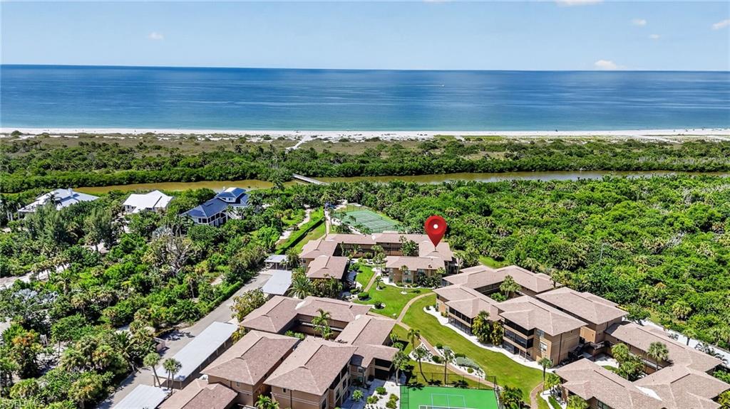 ISLAND LIFE-SALT LIFE! SUN-SEA-SURF & SAND......WELCOME TO "BLIND PASS" CONDO YOUR ISLAND PARADISE, BEAUTIFULLY UPDATED "FULLY FURNISHED" 2 BEDROOM, 2 BATH second-floor condo in the highly desirable BLIND PASS COMMUNITY on Sanibel Island. This property offers the rare combination of modern COASTAL design, comfort, and exceptional value just steps from one of the world’s most celebrated beaches. OPEN FLOOR PLAN, with all tile floors in the entry, halls, kitchen and bathrooms, lush carpeting in the bedrooms. "CHEFS" Kitchen with all WHITE WOOD SHAKER CABINETS, GRANITE TOPS & ALL STAINLESS STEEL APPLIANCES. Whether you're looking for a COASTAL RETREAT, PERFECT INVESTMENT OPPORTUNITY or some of both, you will find it here in BLIND PASS.  From the moment you enter, you'll notice the careful attention to detail and thoughtful design choices that set this unit apart. The kitchen opens directly into the expansive living and dining area, making it easy for entertaining. The lanai offers a peaceful connection to nature, where the sounds of birds and gentle island breezes set the tone for total relaxation. The well-designed split-bedroom layout ensures privacy for both owners and guests. Each spacious bedroom has large walk-in closets, offering ample storage for beach gear, clothing, and more. The bathrooms are equally impressive, with tasteful finishes, updated vanities, and contemporary fixtures that reflect the home’s modern COASTAL DESIGN. This unit has been further enhanced with HURRICANE IMPACT WINDOWS & DOORS which not only improve energy efficiency and storm protection, it makes the home: LIGHT-BRIGHT-SUNNY all year round. BLIND PASS is one of SANIBEL'S truly best-kept secrets. This charming community is nestled on the west end of the island, A SHORT WALK TO THE WORLD FAMOUS BEACHES OF SANIBEL AND BOWMANS BEACH NAMED ONE OF TOP 10 IN THE WORLD. Here, you’ll find soft white sands, SPECTACULAR SHELLING and unforgettable Gulf SUNSETS. BLIND PASS AMENITIES INCLUDE: LARGE HEATED POOL, TENNIS COURT, PICKLEBALL COURTS, BBQ AREA, ON-SITE KAYAK & PADDLE-BOARD RENTALS AND OUR OWN PRIVATE BOARDWALK TO THE BEACH.  Spend your days exploring the mangrove-lined Clam Bayou by kayak, biking along scenic island trails to nearby Captiva, or fishing from the shoreline. IF GENERATING VACATION INCOME WHEN NOT IN RESIDENCE IS IMPORTANT, THEN BLIND PASS IS YOUR ANSWER WITH WEEKLY RENTALS, YOU CAN GENERATE SUBSTANTIAL INCOME WHEN NOT IN USE. HOME COMES WITH ONE YEAR COMPLETE "HOME WARRANTY" FOR TOTAL BUYER COMFORT! Don't wait, this is a PREMIER GROUP "BEST BEACH" VALUE PROPERTY OFFER!