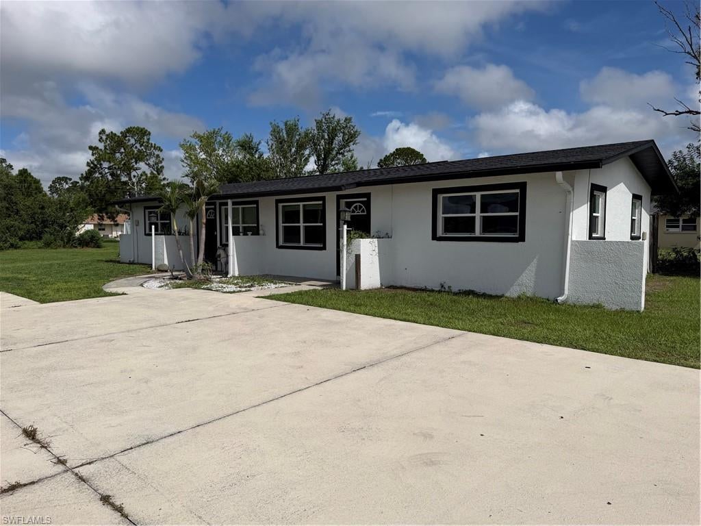 Welcome to your dream home in Lehigh Acres! This stunning duplex features a total of 3 bedrooms and 2 bathrooms, with granite counters, stainless steel appliances, and tile flooring throughout. The main unit boasts 2 bedrooms and 1 bath, while the second unit offers 1 bed and 1 bath, perfect for guests or rental income. With a new roof and mini split AC units, you can enjoy peace of mind and comfort year-round. The property also includes a huge yard with room to build another unit, as well as ample parking for all your vehicles. Both units have been beautifully remodeled, offering a modern and stylish living space for you and your loved ones. Don't miss out on this incredible opportunity to own a piece of paradise in Lehigh Acres!