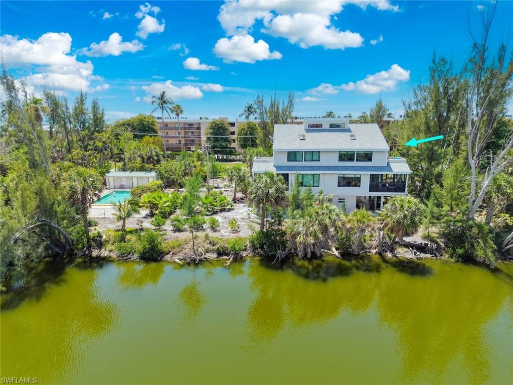 Come to Sea Pines…a small near beach community centrally located on Middle Gulf Dr. on Sanibel Island. This pet friendlycommunity is directly across the street from the beach and includes a pool for the 5 property owners. This half duplex home offers 3bedrooms and 3 baths in a spacious 1680 square feet of living area. In addition, there is a peaceful screened lanai on the main living floor andan upper balcony where you will enjoy the peace and beauty of the lake and wildlife between Sea Pines and the Sanibel Island Golf Course.This unit comes with covered parking under the home for 2 vehicles, a large enclosed storage/workshop on the ground level and an outdoorshower at the base of the stairs which enables you to wash the sand off before entering the home. Feel secure knowing you have impactglass windows throughout along with shutters for the sliders. Located on the main floor there is a bedroom and full bath as well as a fullsized washer and dryer. Upstairs a large primary bedroom and bath just up the hallway from another guest bedroom and bath. This mainbedroom features wood vaulted ceilings and a balcony where you will enjoy the beautiful sunset glow over the pines and the lake. Thisproperty location is ideal for those who would like to be near the beach access or close to nearby public restaurants (across the street atSundial or Ibis Grill in Beachview). The nearest beach access will be at Fulgur St. just about 1/4 of a mile away. Unit C is move in ready. Bringyour pet and your happy kids, and let us help you purchase your slice of paradise on Sanibel Island!