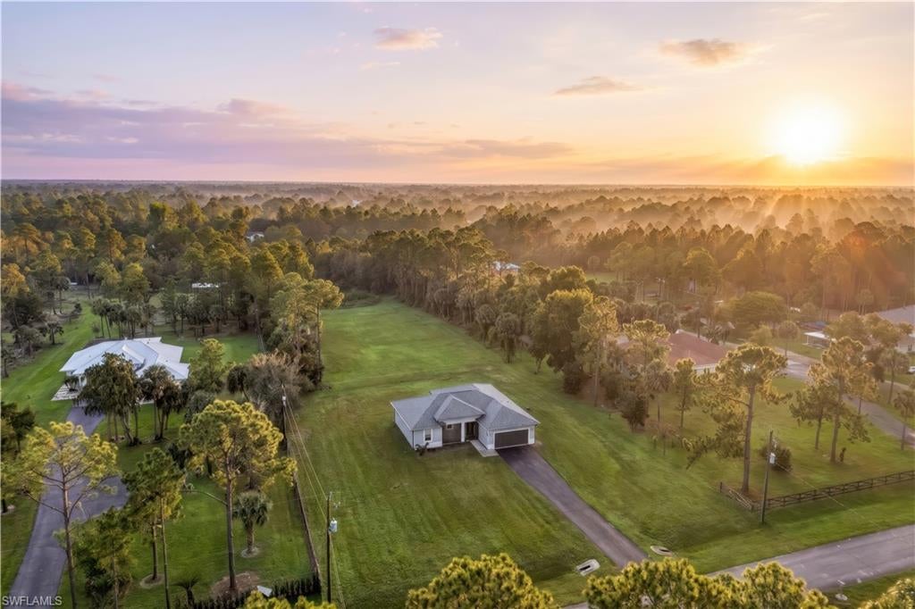 One or more photo(s) has been virtually staged, AI generated or rendered.  One or more photo(s) has been virtually staged, AI generated or rendered. CONTEMPORARY GOLDEN GATE ESTATES HOME ON 2.27 ACRES OF 100% UPLANDS! NO HOA! Built in 2019, this charming 3-bedroom, 2-bath home offers the perfect combination of modern comfort, open space, and future possibilities. Situated on 2.27 acres in the growing Golden Gate Estates area of Naples, this property offers room to create your ideal Southwest Florida lifestyle, with space to consider a pool, guest house, workshop, or equestrian use, subject to applicable zoning and permitting requirements. The 100% uplands designation is an exceptional feature for buyers seeking usable acreage and added flexibility. Inside, the kitchen showcases beautiful granite countertops, white real-wood cabinetry, and stainless-steel appliances. A tray ceiling adds character to the living room, while tile flooring throughout offers a clean, cohesive look and easy maintenance. The generously sized laundry room features a utility sink for added convenience. Enjoy the freedom of country-style living with convenient access to the growing commercial area near Everglades Boulevard and Golden Gate Boulevard. Whether you're looking for room to spread out, space for your hobbies, or an opportunity to make the property your own, this Golden Gate Estates home is full of potential. Discover the possibilities and schedule your private showing today!