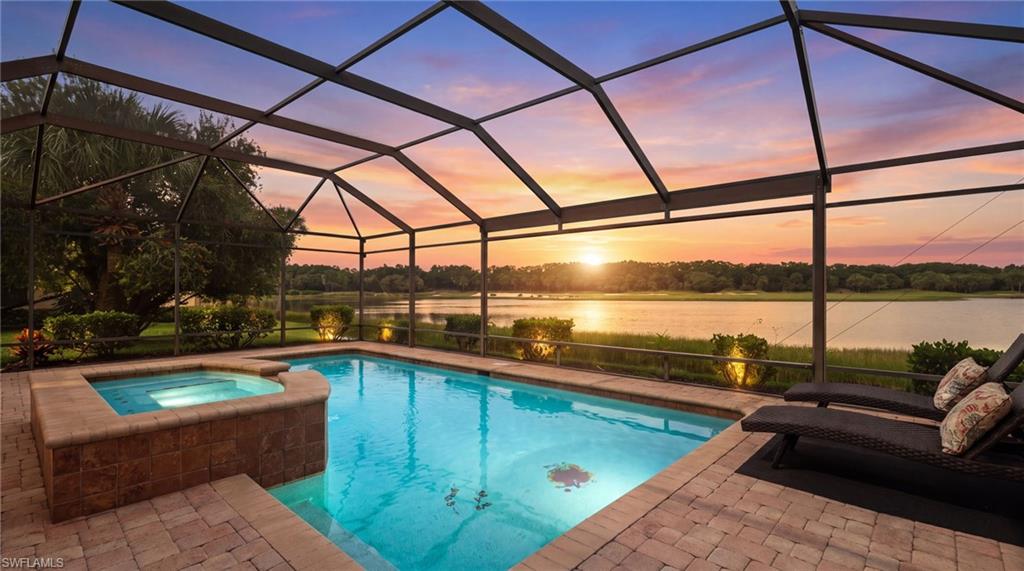 Discover an exceptional lifestyle in this beautiful two-story single-family residence in Miromar Lakes Beach & Golf Club, showcasing stunning long lake views and picturesque vistas of the Arthur Hills Signature Championship Golf Course. Perfectly positioned to capture breathtaking northwest sunsets, this inviting home blends timeless style, spacious living areas, and an ideal setting for enjoying the best of Southwest Florida living.

Offering four bedrooms, three full bathrooms, a half bath, and a versatile loft, the thoughtfully designed floor plan provides ample space for everyday living, hosting guests, and entertaining. The open-concept living areas create a natural flow between indoor and outdoor spaces, while the spacious, enclosed lanai serves as a private retreat overlooking the beautiful lake and manicured golf course. Spend your days lounging beside the sparkling pool, unwinding in the spa, or gathering with family and friends to enjoy spectacular sunsets over the water. Recent updates include a newer roof, kitchen appliances, water heater, and air conditioning system, adding to the home's appeal.

Life at Miromar Lakes extends far beyond your front door. Recognized for its exceptional resort-style lifestyle, this award-winning community encompasses approximately 700 acres of freshwater lakes and features three miles of private white-sand beach. Residents can enjoy a remarkable selection of amenities, including a beautiful Beach Club, waterfront dining at Blue Water Beach Grill, indoor and outdoor bars, and a stunning 10,000-square-foot zero-entry infinity pool overlooking the lake. Boating enthusiasts will appreciate the community's two marinas, along with opportunities for kayaking, paddleboarding, and enjoying the expansive freshwater waterways.

The lifestyle continues with a full-service spa and salon, state-of-the-art fitness center, Har-Tru tennis courts, pickleball, bocce, and scenic walking and biking paths. Golf enthusiasts can enjoy the renowned Arthur Hills Signature Championship Golf Course, with golf membership options available. An active social calendar, elegant gathering spaces, and a vibrant community atmosphere provide endless opportunities to connect with neighbors, entertain guests, and embrace the Florida lifestyle.

Whether you envision peaceful mornings overlooking the golf course, afternoons spent poolside, days on the water, or evenings watching the sun set across the lake, this exceptional Miromar Lakes home offers an inviting blend of comfort, scenic beauty, and resort-inspired living.
One or more photo(s) has been virtually staged, AI generated or rendered.