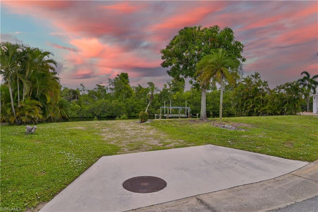 One of the largest Gulf-access lots in Bayside Estates! Located on a quiet cul-de-sac, this exceptional waterfront property offers over 92 feet of canal frontage and gorgeous views of the Estero Bay Buffer Preserve directly across the canal—providing a peaceful, private setting that is increasingly hard to find.

Much larger than the average homesite in the community, the lot offers plenty of room to build a large custom manufactured home with a garage. The curved street frontage and generous lot dimensions create additional possibilities when designing your new Florida home. The lot has already been cleared and is ready for your vision.

Enjoy Gulf access from your backyard and the best of the Southwest Florida lifestyle. Bayside Estates is a highly desirable, active 55+ boating community located just off Fort Myers Beach in the heart of the island area. Walk, bike, or boat to the beach and enjoy nearby restaurants, shopping, boating, and everything Southwest Florida has to offer.

If you’ve been waiting for the right waterfront homesite to build your Florida dream home, this combination of size, Gulf access, preserve views, peace, and privacy makes this one truly special.

Buyers in Bayside Estates pay a $2,800 resale capital contribution fee.