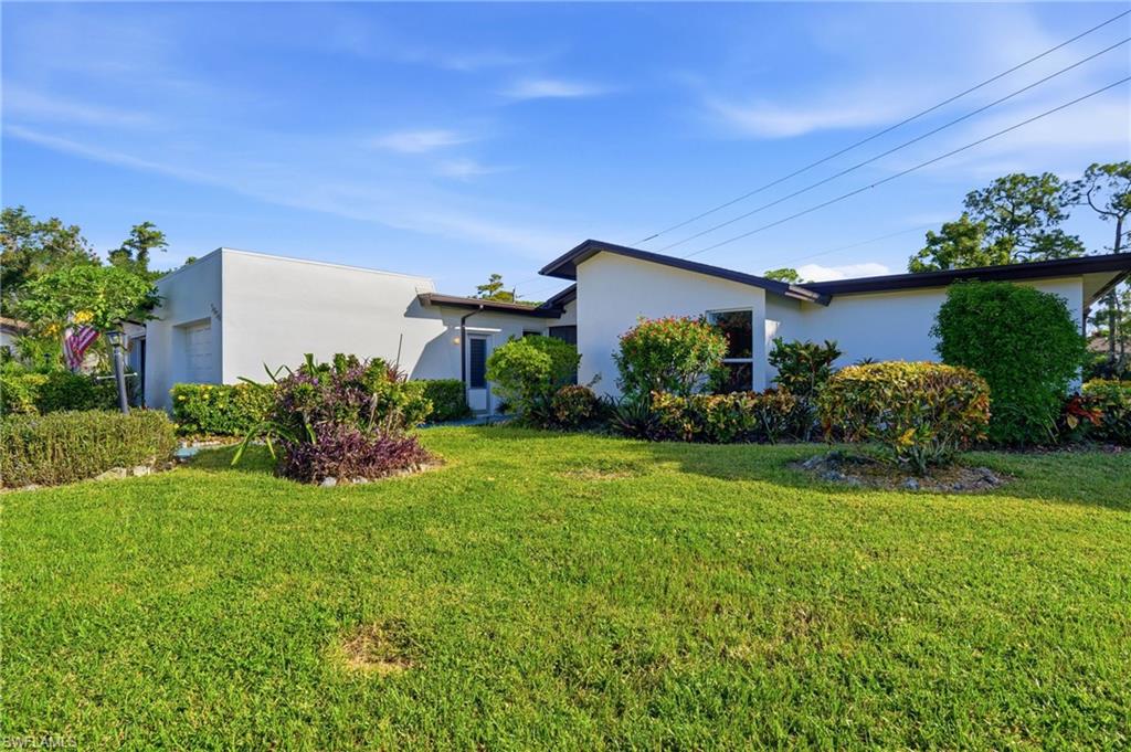 WATERFRONT VIEWS, END-UNIT, AND ENDLESS POSSIBILITIES! Discover an exciting opportunity to transform this SPACIOUS 1346+ SQ. FT., SINGLE-STORY, 3-BEDROOM, 2-BATH END-UNIT VILLA into your very own!!  Offered TURNKEY FURNISHED and complete with an ATTACHED 1-CAR GARAGE and EXTRA STORAGE - this residence features a DESIRABLE, ROOMY FLOOR PLAN, an abundance of natural light, and BEAUTIFUL POND VIEWS FROM MULTIPLE ROOMS throughout the home. Ready for a fresh new look, this villa presents the perfect canvas for buyers with vision to update, personalize, and create something truly special! One of the home's most captivating features is the EXPANSIVE REAR LANAI overlooking a SERENE POND, where visiting wading birds, playful otters, and peaceful water views provide an ever-changing natural backdrop. Imagine morning coffee, afternoon relaxation, or evening gatherings surrounded by the sights and sounds of Southwest Florida! The END-UNIT LOCATION adds to the OPEN, AIRY FEEL, offering the space and comfort of a home with the convenience of villa living. Nestled within the LAKEWOOD COMMUNITY, where a PUBLIC GOLF COURSE winds through green fairways, picturesque ponds, and tropical landscapes -  this property captures the charm of the Naples lifestyle. Golf enthusiasts will appreciate having a public golf course right in the community!! LOCATION, LOCATION, LOCATION! Just minutes from DOWNTOWN NAPLES and the renowned 5TH AVENUE SOUTH, offering exceptional dining, boutique shopping, art galleries, and entertainment—plus the BEAUTIFUL WHITE-SAND BEACHES and spectacular GULF SUNSETS! Whether you're envisioning a YEAR-ROUND RESIDENCE, SEASONAL GETAWAY, or INVESTMENT OPPORTUNITY, this villa offers the LOCATION, LAYOUT, AND WATERFRONT SETTING to make your Naples dream a reality. Did I mention the FRUIT TREES???  LOW HOA FEES INCLUDE CABLE & INTERNET! Bring your vision, add your personal touch, and unlock the possibilities of this Naples property.  Buyer to verify all information.