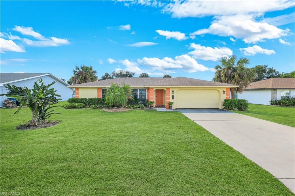 POOL HOME WITH COMMUNITY GULF ACCESS, LOW HOA FEES AND A BOAT RAMP JUST MINUTES AWAY! Welcome to 6025 Macbeth Lane, located in the desirable Island Park Woodlands community of Fort Myers! This beautifully updated 3 bedroom, 2 bathroom home offers 1,660 square feet of living space, a 2 car garage, and a spacious open floor plan designed for comfortable everyday living and entertaining. Step inside to discover a bright, inviting interior featuring luxury vinyl plank flooring throughout, fresh neutral finishes, updated lighting, ceiling fans, and an electric fireplace that adds a modern touch to the living area. The renovated kitchen features beautiful white countertops, dark shaker style cabinetry, a decorative mosaic tile backsplash, stainless steel appliances, a breakfast bar with seating, and a convenient pass through window overlooking the pool. The spacious great room flows effortlessly into the dining area, where sliding glass doors open to your own private outdoor retreat. The primary suite offers direct access to the pool area, a generous walk in closet, and an ensuite bathroom with a tiled walk in shower and wood cabinetry. Two additional bedrooms provide comfortable accommodations, while the flexible floor plan offers space for a home office or additional sitting area. Step outside to the expansive screened lanai featuring a sparkling in ground chlorine pool, beautiful brick pavers, multiple lounging areas, and plenty of covered space for relaxing or entertaining. Southern rear exposure provides wonderful natural light throughout the day, while the landscaped backyard adds to the home's tropical appeal. Major improvements include a 2023 A/C system, 2018 roof, updated electrical panel in 2023, and insulated Low E windows and sliding doors installed in 2023. Additional features include automatic irrigation, an interior laundry room, and an epoxy finished garage floor. One of the biggest highlights of this property is its location within Island Park Woodlands, a boating community offering a neighborhood boat ramp just minutes down the road with access to Ten Mile Canal, Mullock Creek, Estero Bay, and the Gulf of Mexico! Residents can also enjoy community amenities including tennis and pickleball courts, a playground, basketball, fishing areas, and a community boat dock, all with LOW HOA FEES OF JUST $240 PER YEAR and assumable flood insurance! Conveniently located near The Forest Country Club, shopping, dining, Southwest Florida International Airport, and the beautiful beaches of Fort Myers and Sanibel, this home combines modern updates, a private pool, and access to Southwest Florida's incredible waterways. Schedule your private showing today!
