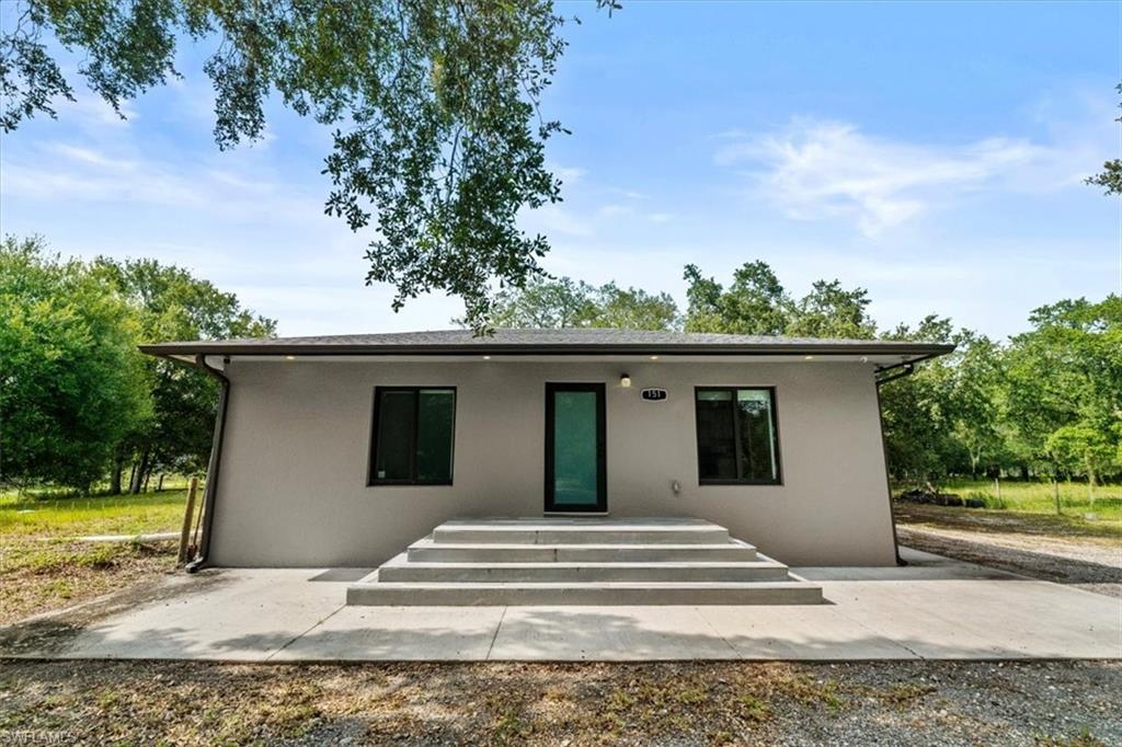 Discover the perfect blend of modern living and outdoor freedom with these two adjacent lots totaling 2.5 acres in Montura Ranches. This turn-key, newer-construction home features 2 bedrooms, 1 bathroom, sleek tile flooring, and impact windows and doors for total peace of mind. The stylish kitchen has granite countertops, wood cabinetry, and stainless steel appliances. Operating on well and septic, this expansive property is a haven for horse lovers, animal enthusiasts, and outdoor lifestyles. Enjoy community perks with the Montura Ranches clubhouse, pool, and playground just minutes away. Live comfortably now while you plan, with ample space to build your ultimate dream estate! Sellers are motivated!
