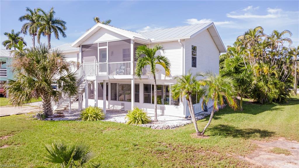 Experience owning a slice of paradise in this fully and tastefully remodeled home.   Each room has been extensively updated to enjoy comfortable island living within its light filled spaces. The new kitchen and baths with walk-in showers are amazing. A metal roof was installed three years ago, and recently a water heater. This area of the island is golf cart friendly so you may ride it to local restaurants, bars, shopping or simply cruise around the entire neighborhood.  Whether used as a full-time residence, seasonal, or an investment property, this home would easily fulfill your desires.  Pine Island is a nature lover's paradise in addition to offering access to world class fishing. It has several county parks  and a bike path almost the entire length of the island.  Are you a baseball fan?  Southwest Florida has many MLB spring training locations all within an easy drive.  If you enjoy sun, salt, fishing, boating, baseball or great fresh seafood, Pine Island is the right place for you and your family. Start living on "Island Time."
